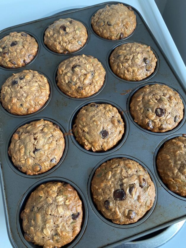 A dozen freshly baked Fall Spiced Oat & Chocolate Chip Muffins